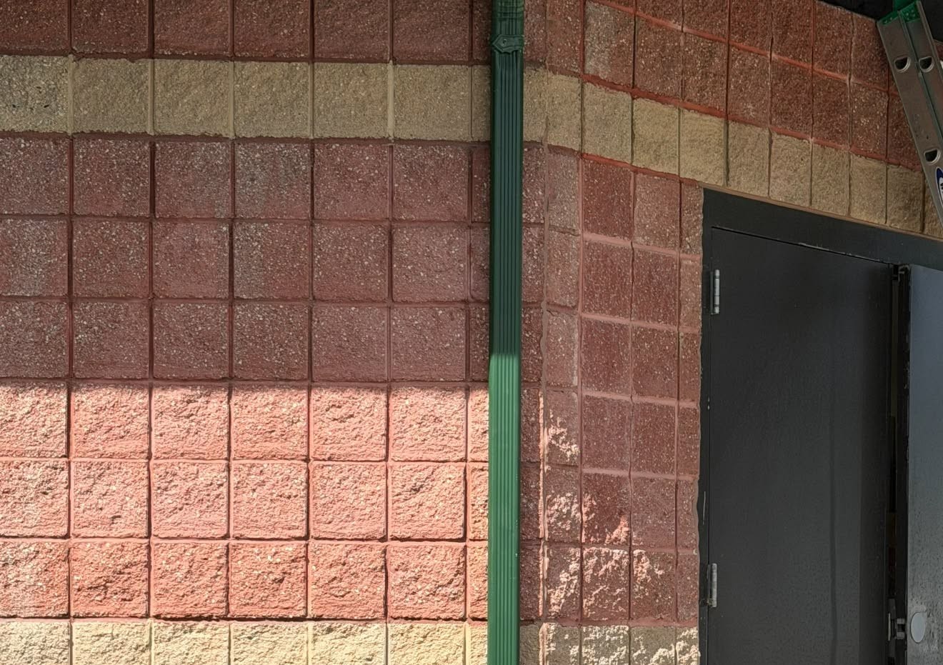 Repainted red brick exterior wall