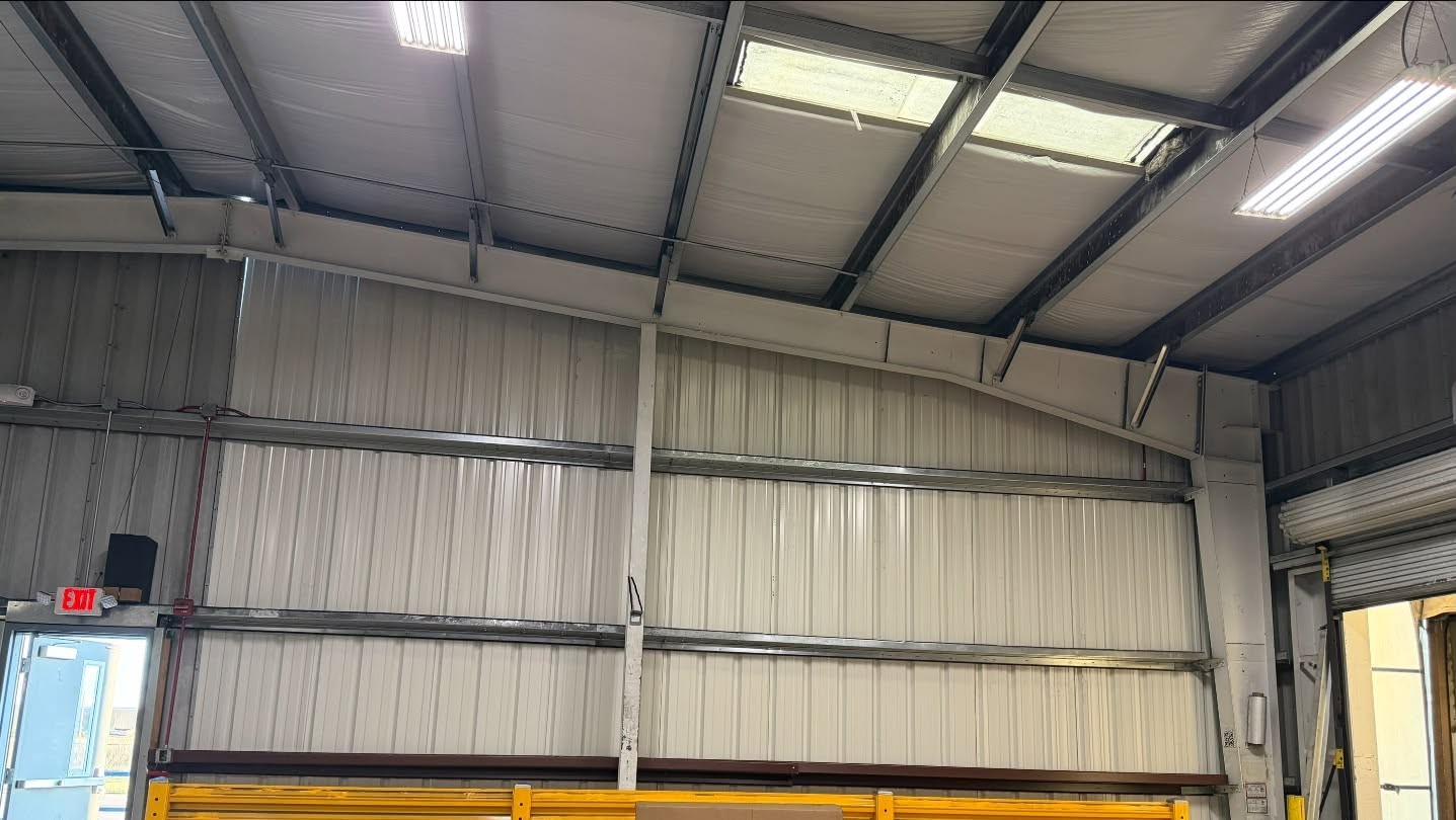 Repainted warehouse interior wall and ceiling